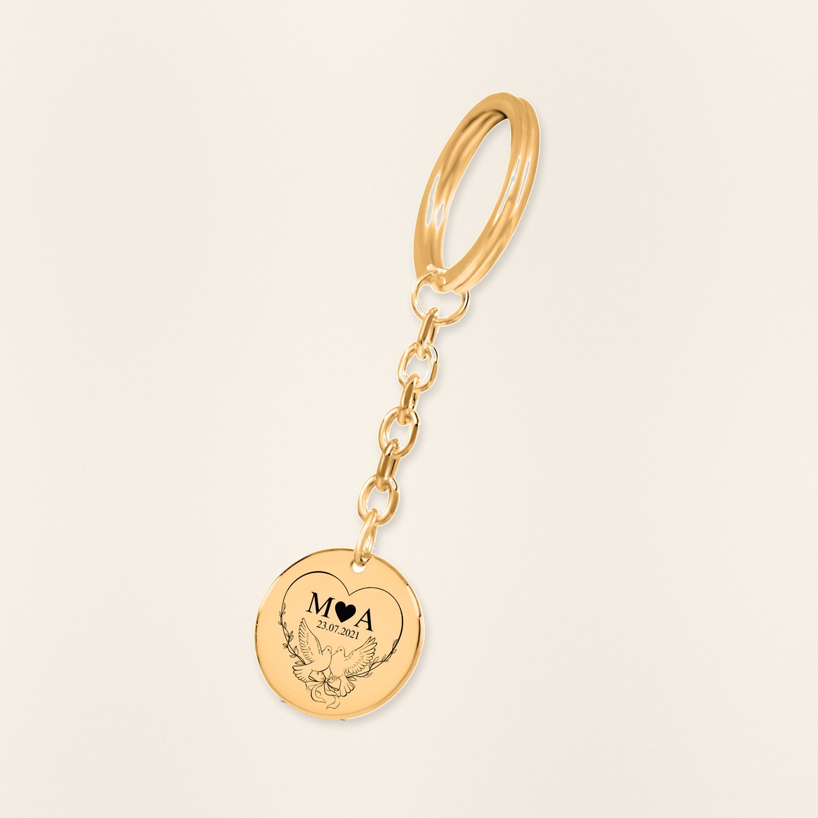 Porte-clés Initiales Entrelacées Personnalisé (Timeless Bond) en finition dorée, exemple de gravure sur fond ivoire texturé.